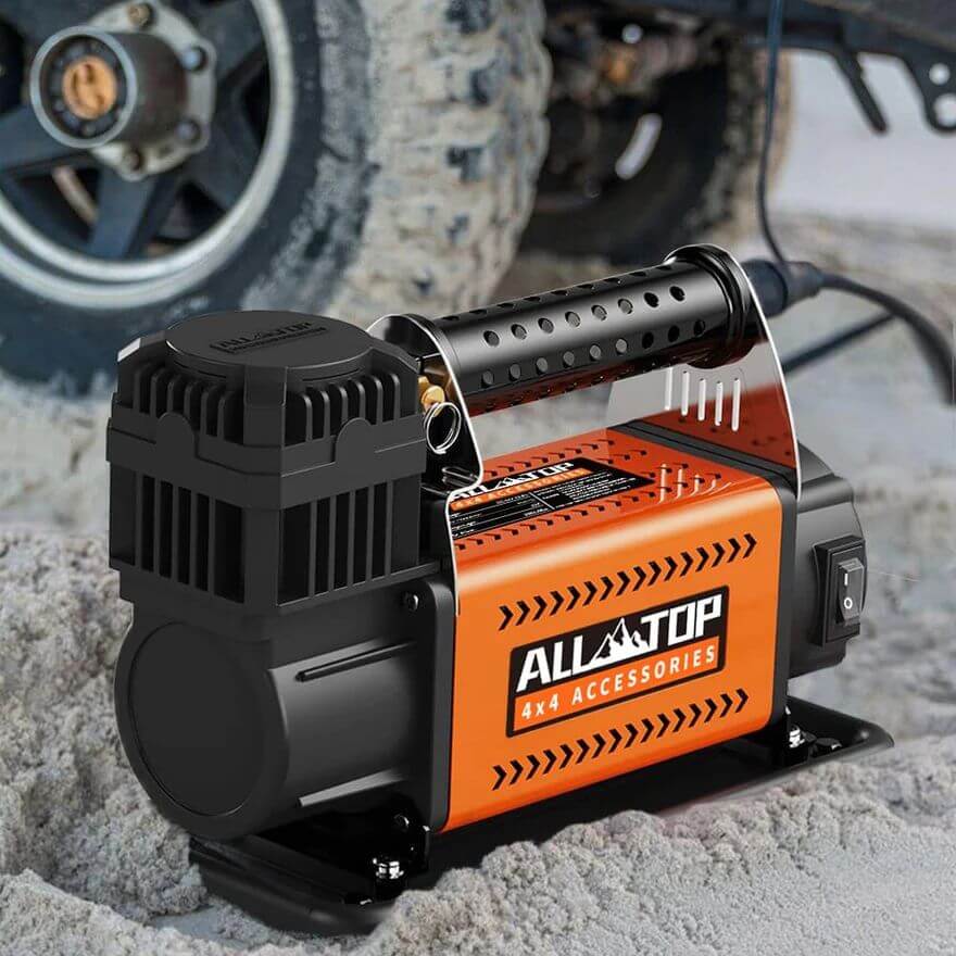 All-TOP air compressor next to tires